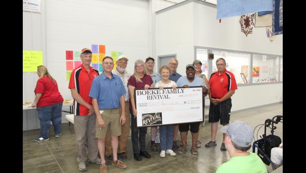 Right: Front Row: Sam Boeke, Spiff Slifka, Gwen Boeke and D.C. Randle. Back Row: Fair Board President Jim Irvin, Jeff Boeke, Gregg Boeke, Dean Guerdet, Lisa Boeke and Fair Board Executive Secretary Tom Barnes.
