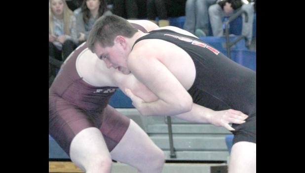 Cadet senior Trevor Trende, right, attacks Travis Capelle of Team Minnesota during the Border Battle Meet Friday. Capelle won a 3-0 decision.