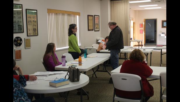 Mary Bielefeld takes the oath of office by Lime Springs Mayor Brian Johnson.