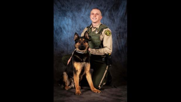 Howard County Deputy Ben Hillier is shown with Legend, the new K-9 officer.
