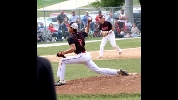 Calvin Bodensteiner delivers a pitch during Turkey Valley's playoff game against Nashua-Plainfield.