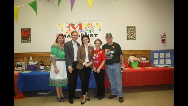 Audrey Novak, vice president of Czech Heritage Partnership; Borek and Katerina Lizec, Consulate General; and Lois and Ken Zajicek, new president of Czech Heritage Partnership stand in front of the silent auction table at Masopust on Feb. 10.