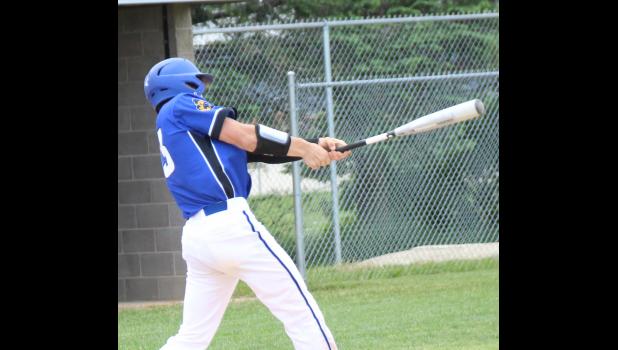 Colter Bye rips into the ball against New Hampton.