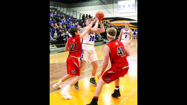 Garret Ollendieck goes up for a shot attempt against New Hampton on Feb. 19.