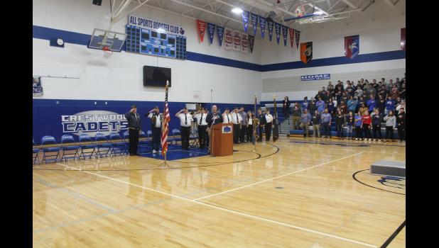 Veterans, guests and staff and students of How-Winn. said the pledge of allegiance before the Veterans Day program on Thursday.