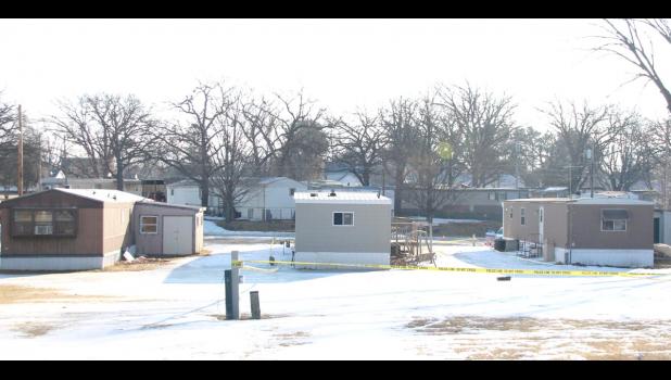 SWAT stood behind the trailer on the left before firing tear gas into the windows of the center trailer.