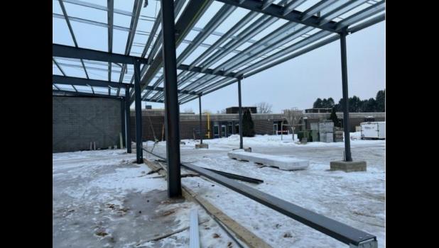 The weight room from the north. The overhang is outside the building and the poles in the center will hold nearly floor to ceiling windows.