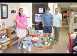 Crestwood Student & Family Caseworker Denise Headington, Crestwood Student Ben Riley and TPD Publisher Dan Evans at the Times Plain Dealer office picking up supplies and donations to bring back to the Cadet Care Closet at Crestwood.