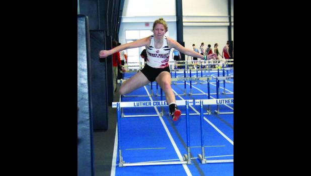Haley Hanson clears a hurdle during the 55 meter hurdles event during a recent meet.