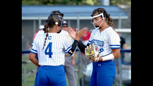 Ava Daley (4) gives Kiernan Ruppert a hive five during a recent game.
