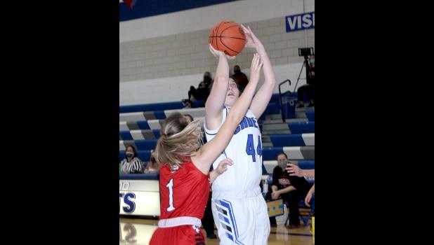 Amelia Nelson takes a shot over a Cedar Falls defender.