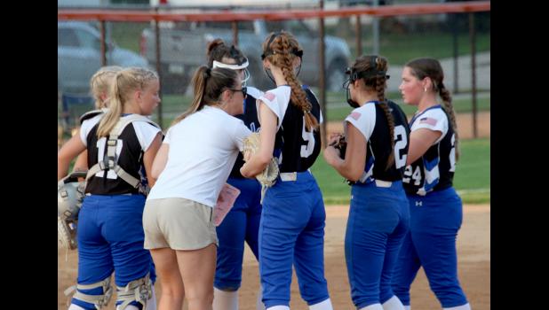 Coach Alicia Denner talks to her team during the game against West Delaware.