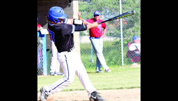 Crestwood's Landen Bergan rips into the ball during a recent Cadet home game.