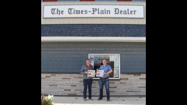 Dan Evans and Nate Troy pictured in front of the Times Plain Dealer newspaper office.