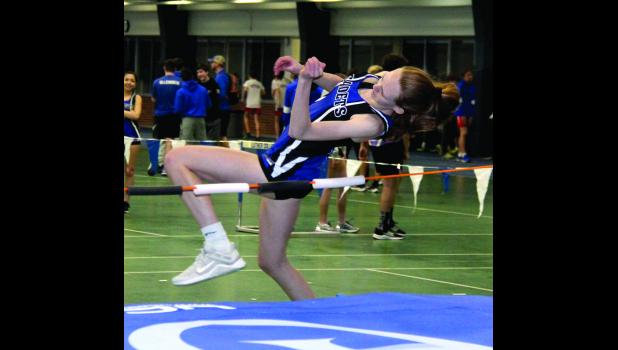 Ella Bergan makes an attempt in the high jump event at the Decorah Meet on March 19.