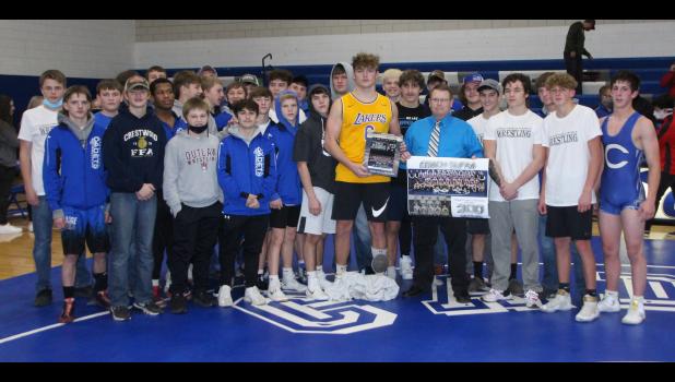 Crestwood Head Wrestling Coach Keith Slifka is congratulated by his team after winning his 300th career dual on Dec. 10. The Cadets beat NH-TV, 43-24.