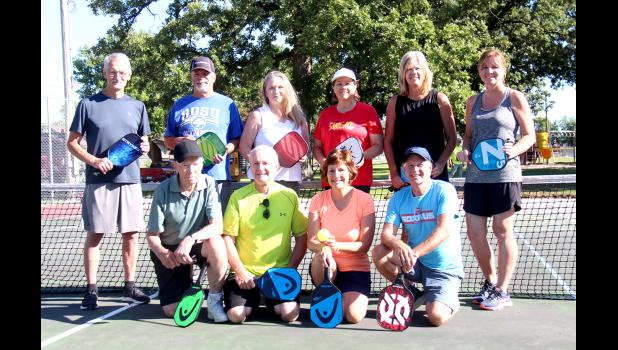 Members of the Pickleball morning group include, first row left to right: Jerry Wilson, Rick Hagen, Sandy Hagen and Jim Obermann. Back row: Bob Gast, Larry Shroyer, Sandy Shroyer, Sue Murphy, Vicki Sovereign and Paula Galvin. Not pictured include: John Heisler, Marge Sovereign, Reuben Hershberger, Marv Praska, June Moudry, Cheryl Mracek, Lynn Murray, Darla Erickson, Corey Gesell, Danielle Baldwin and Tony Sturm.