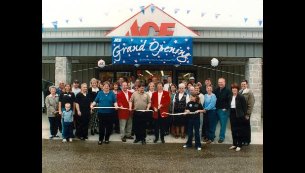 The couple during their Re-Grand Opening, when they opened their new store in 2000, along with members of the Chamber of Commerce